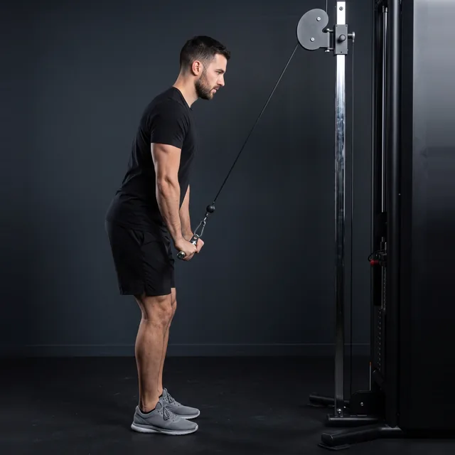 A person doing cable triceps pushdowns