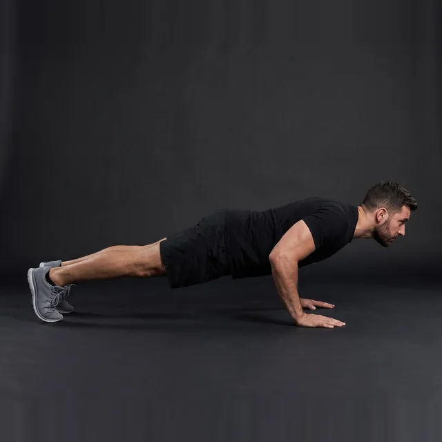 A person doing close-grip push-ups