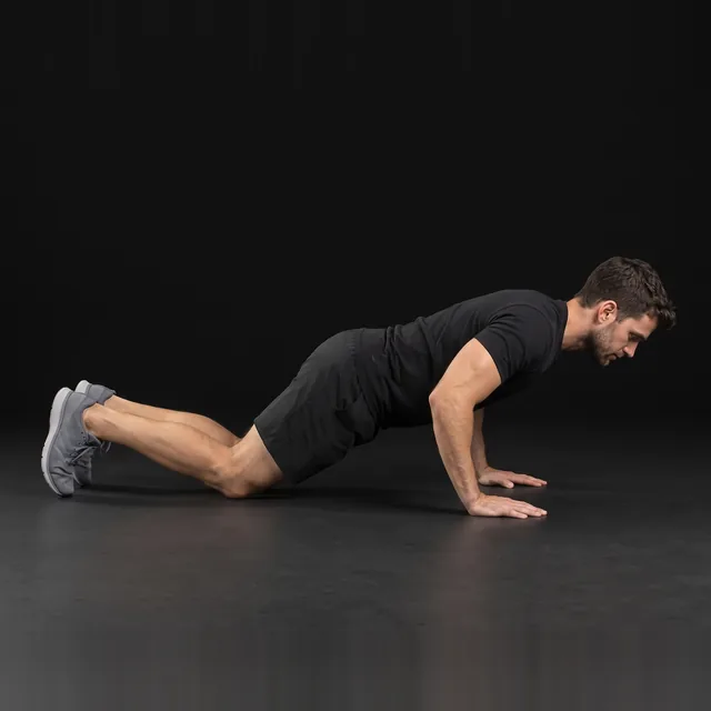 A person doing knee push-ups