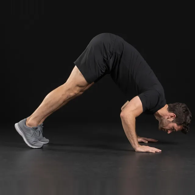 A person doing pike push-ups