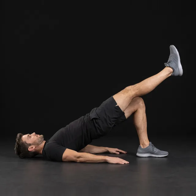 A person doing single-leg glute bridges